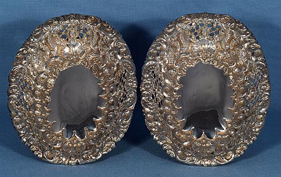 A matched set of four Victorian embossed silver dishes (two pairs), by Horace Woodward & Co/ Ltd, length largest 245mm, weight 56oz